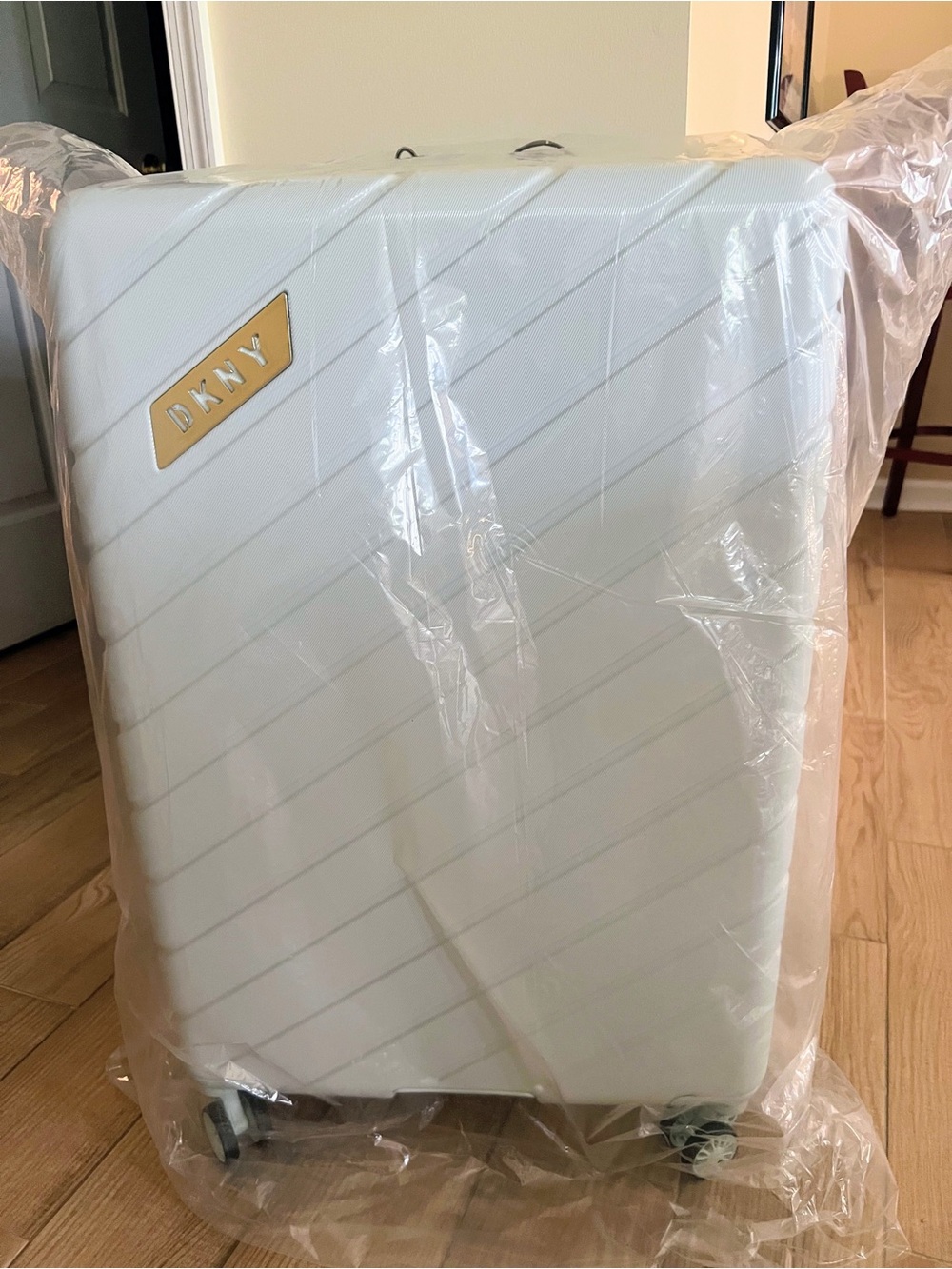DKNY White Hard-Shell Spinner Luggage with Gold Accent